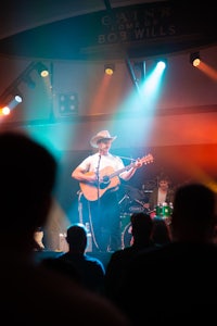 a man playing an acoustic guitar