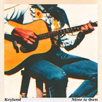 a man playing an acoustic guitar